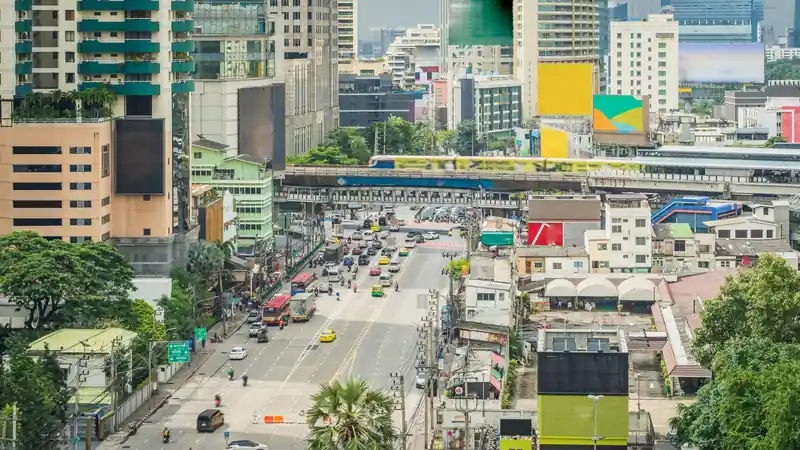 Crossing the City Above the Traffic, from One Glass Walkway to the Next